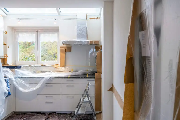 Modern newly renovated kitchen in a completed fix-and-flip home featuring updated cabinets, countertops, and appliances for increased property value.
