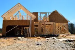 Newly framed residential home under construction showcasing the early stages of a ground-up building project financed with a new construction loan.
