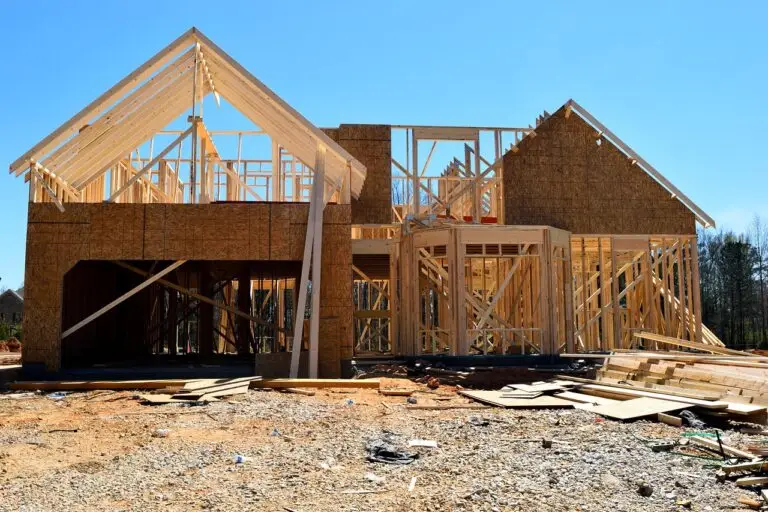 Newly framed residential home under construction showcasing the early stages of a ground-up building project financed with a new construction loan.