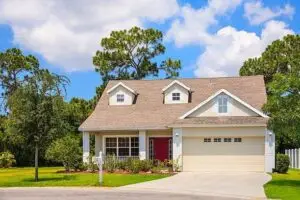 Single-family rental property with landscaped front yard, ideal for real estate investors seeking rental property financing.